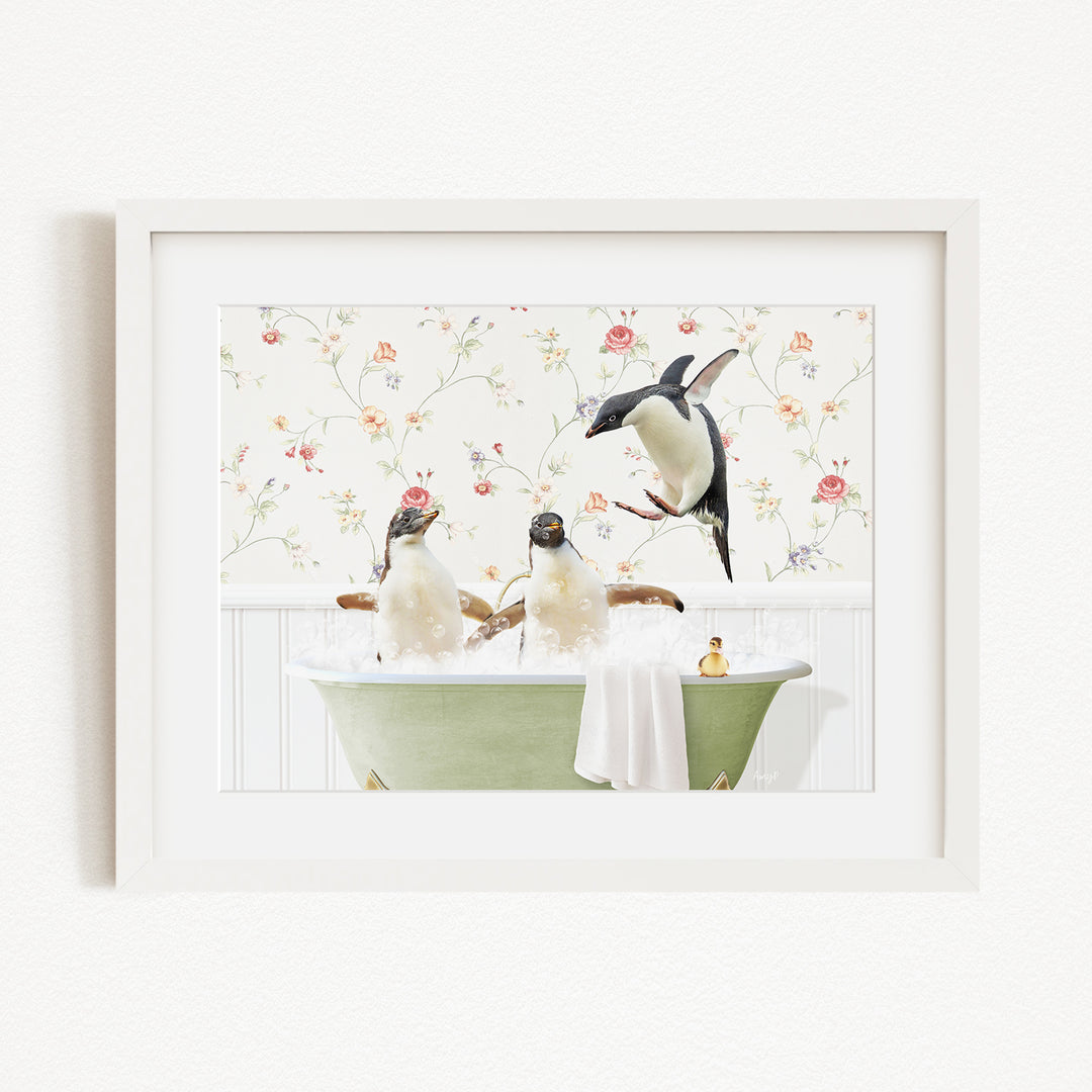 A framed image depicting three penguins enjoying a relaxing bath in a green tub, with a floral wallpaper in the background.