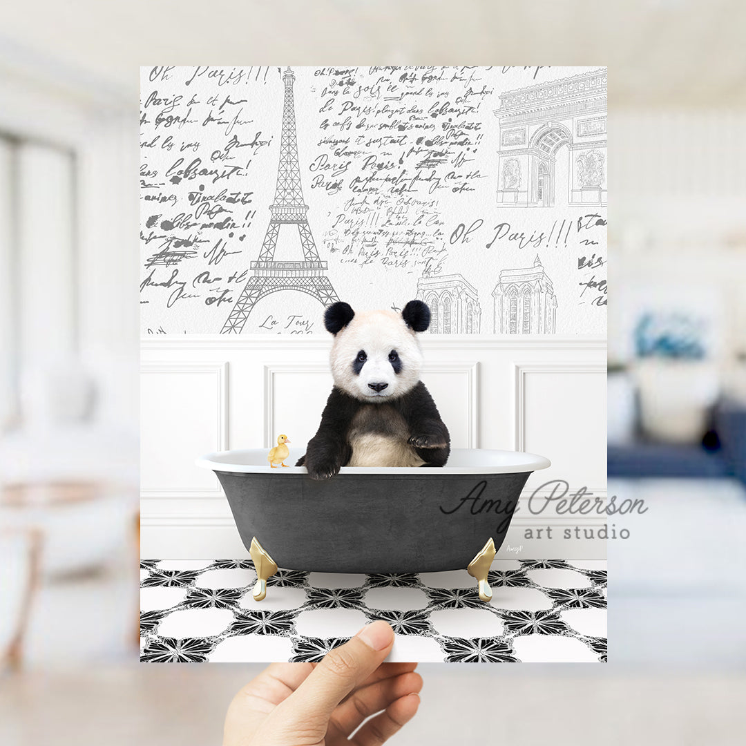 a person holding a card with a panda bear in a bathtub