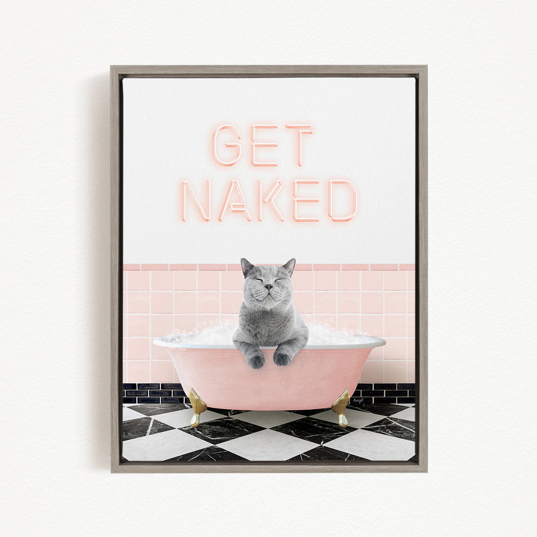 A gray cat sitting in a pink bathtub, with the text "GET NAKED" displayed above it.