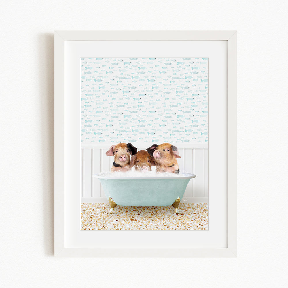 Three adorable pigs sitting in a light blue bathtub, surrounded by a patterned wall and a tiled floor.