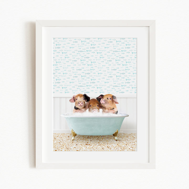 Three adorable pigs sitting in a light blue bathtub, surrounded by a patterned wall and a tiled floor.