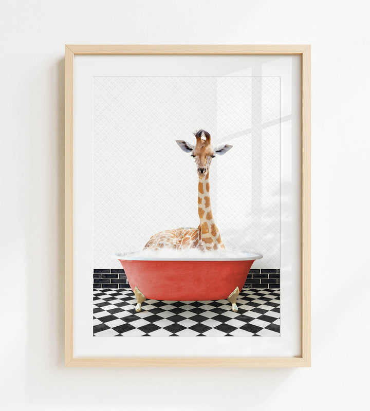 A giraffe is sitting in a red bathtub filled with bubbles, surrounded by a black and white checkered floor.