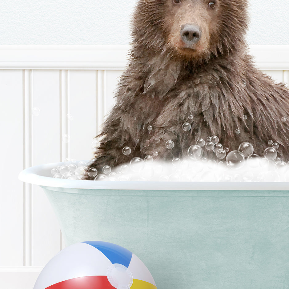 a brown bear sitting in a bathtub with bubbles