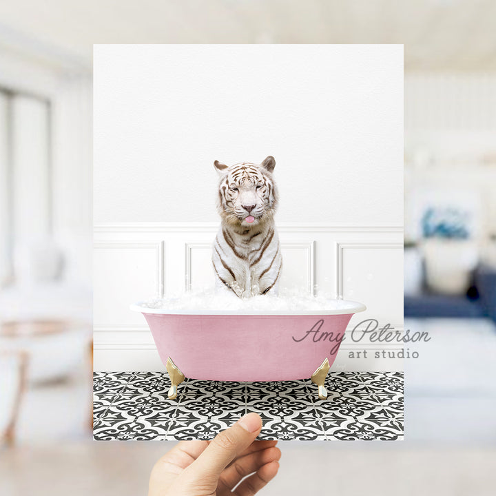 a white tiger sitting in a pink bath tub