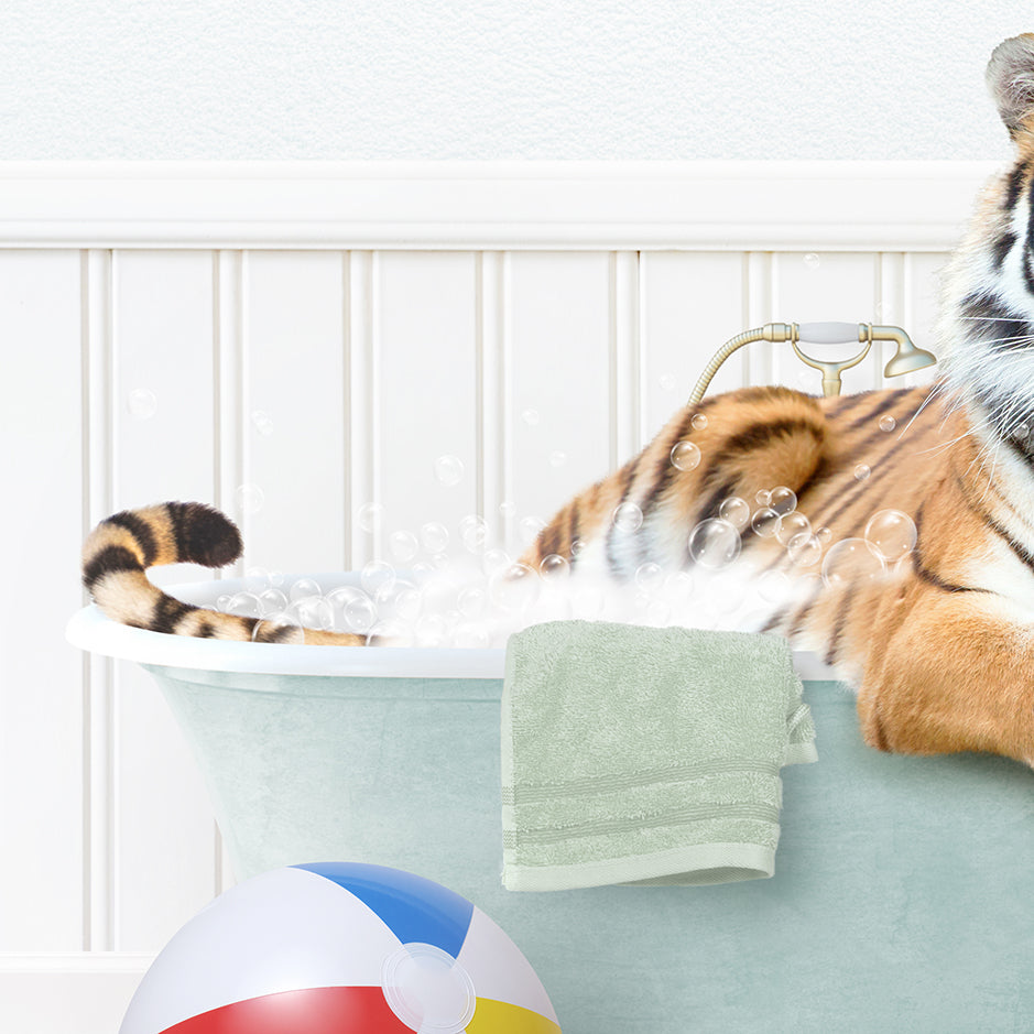 a tiger laying in a bathtub with bubbles coming out of it