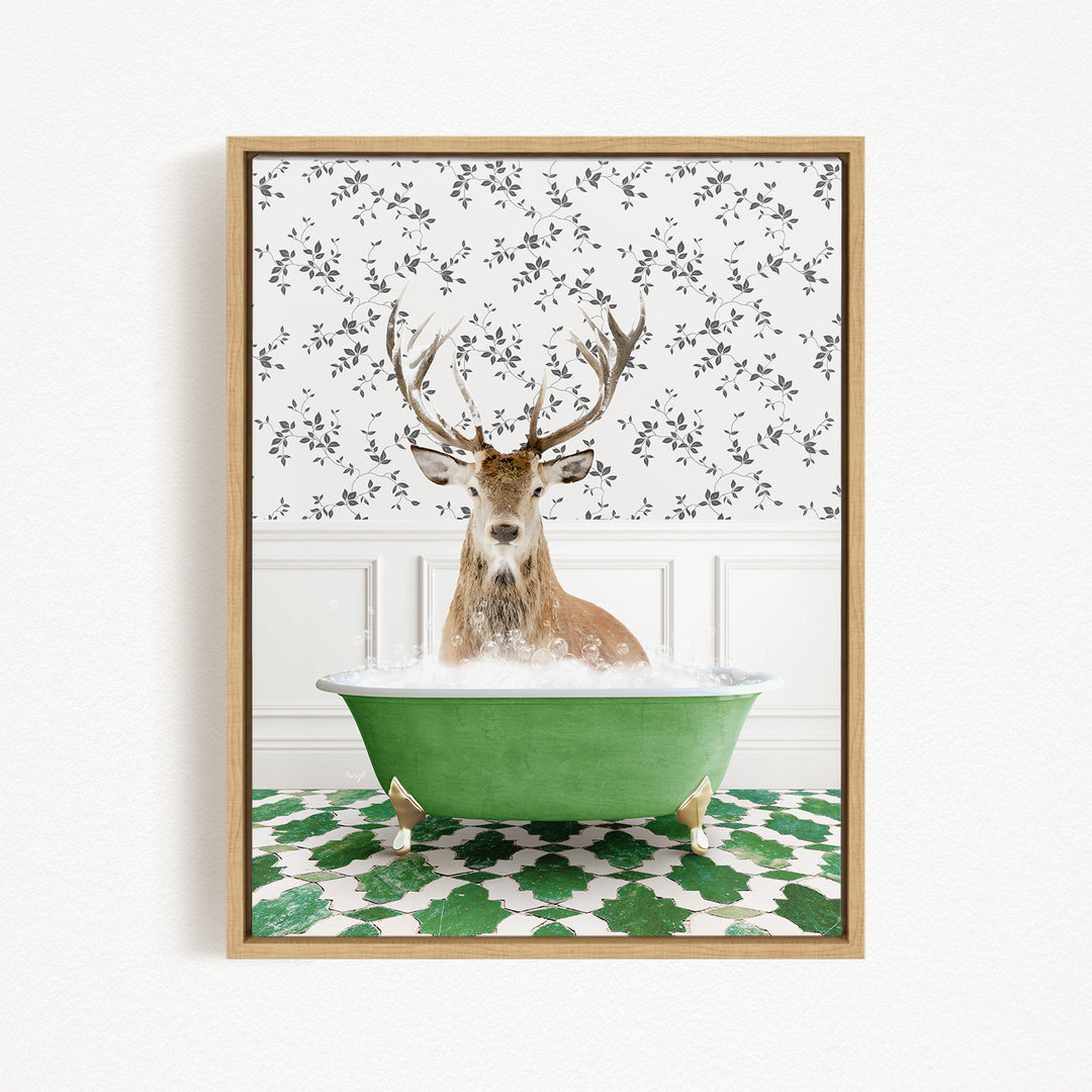 A deer with antlers is sitting in a green bathtub filled with water, surrounded by a patterned green and white floor.