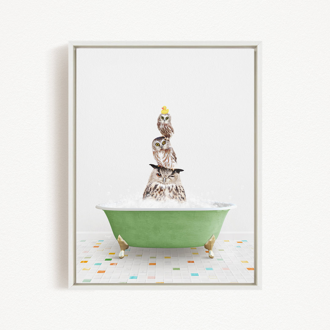 A framed image depicting a group of owls sitting in a green bathtub filled with bubbles, creating a whimsical and playful scene.