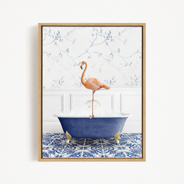 A pink flamingo standing on the edge of a blue bathtub filled with water, set against a white wall with a blue floral pattern.
