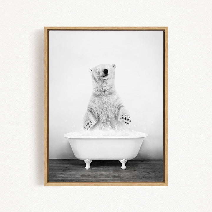 A polar bear standing in a white bathtub filled with water, appearing to be enjoying a bath.