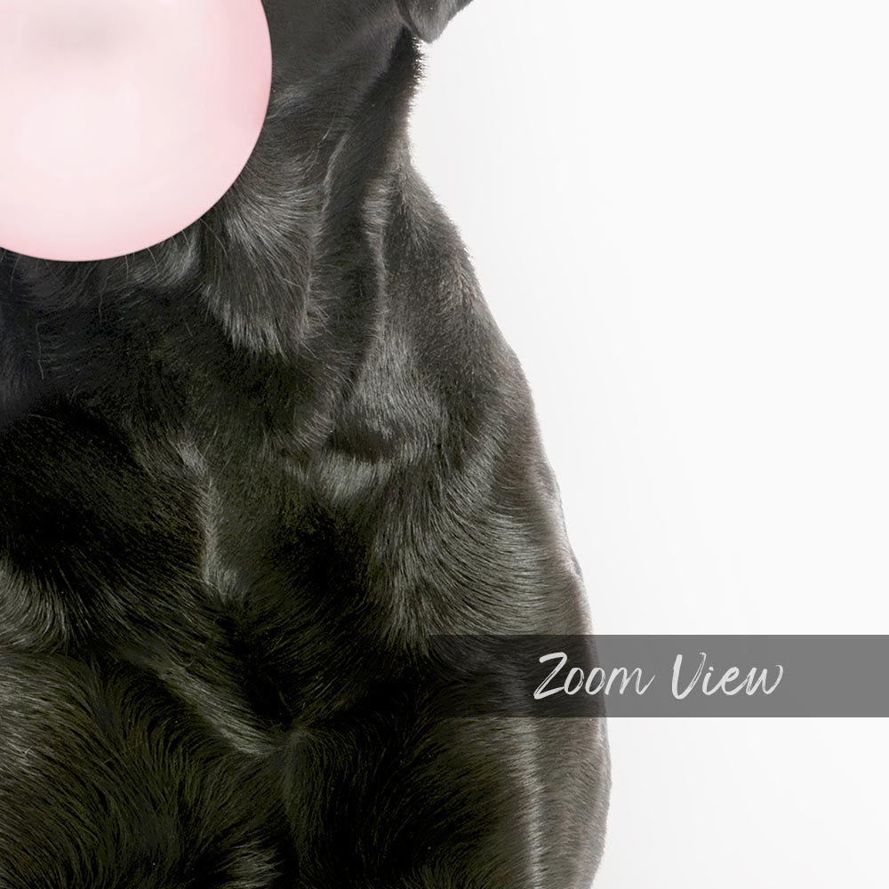 a black dog with a pink bubble in its mouth