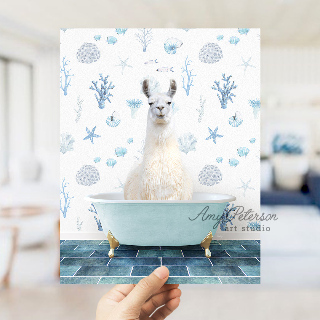 a llama sitting in a bathtub with a hand holding up a card