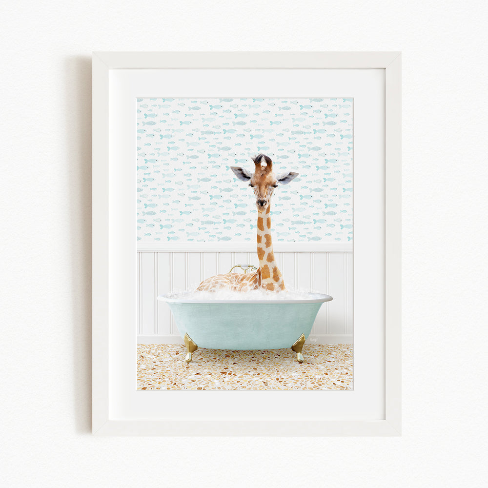 A giraffe standing in a blue bathtub filled with bubbles, with a patterned wall behind it.