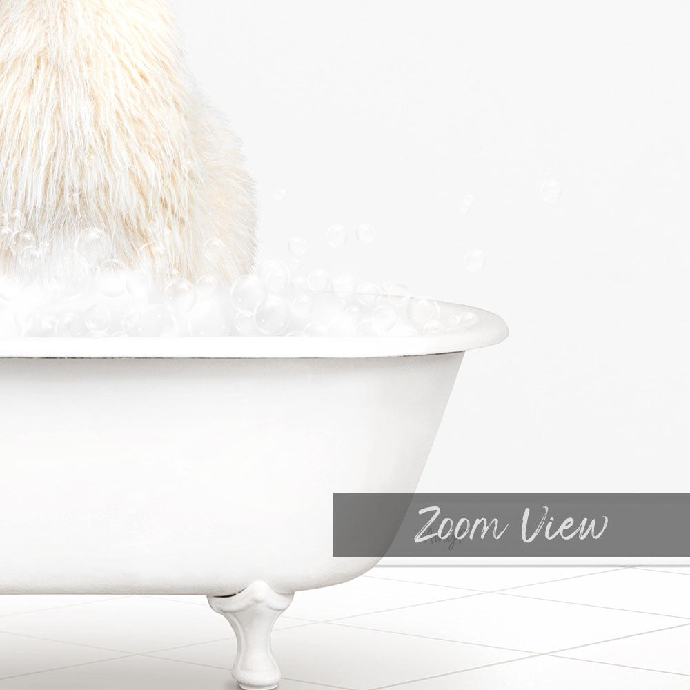 A fluffy white dog sitting in a white bathtub filled with bubbles, with the text "Zoom View" in the bottom right corner.