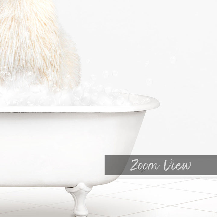 A fluffy white dog sitting in a white bathtub filled with bubbles, with the text "Zoom View" in the bottom right corner.