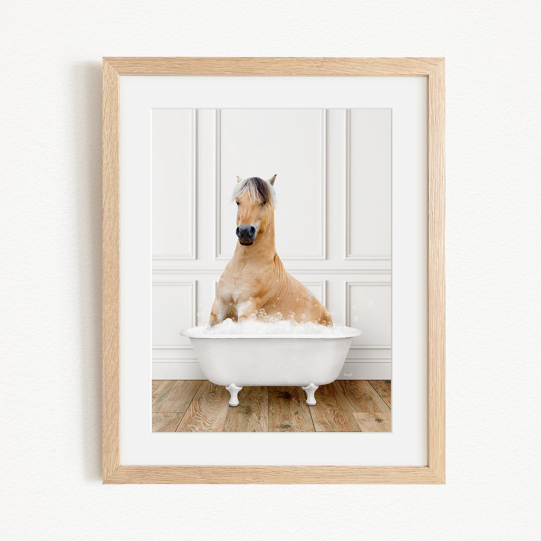 A brown horse sitting in a white bathtub filled with water, with a wooden floor and white walls in the background.