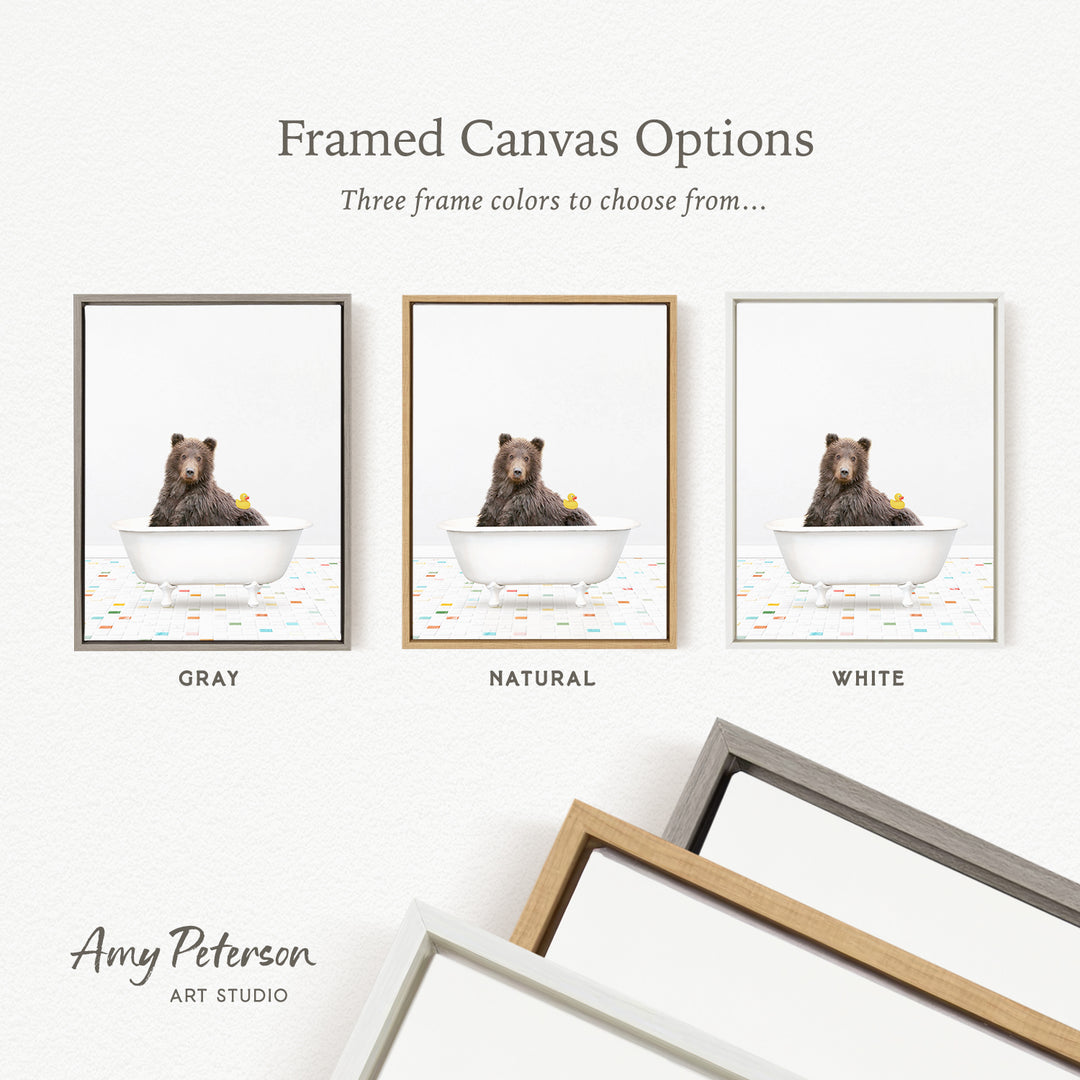 three framed canvas options, each featuring a bear sitting in a bathtub. The options include a gray frame, a natural frame, and a white frame. The bear in the bathtub is a rubber duck.