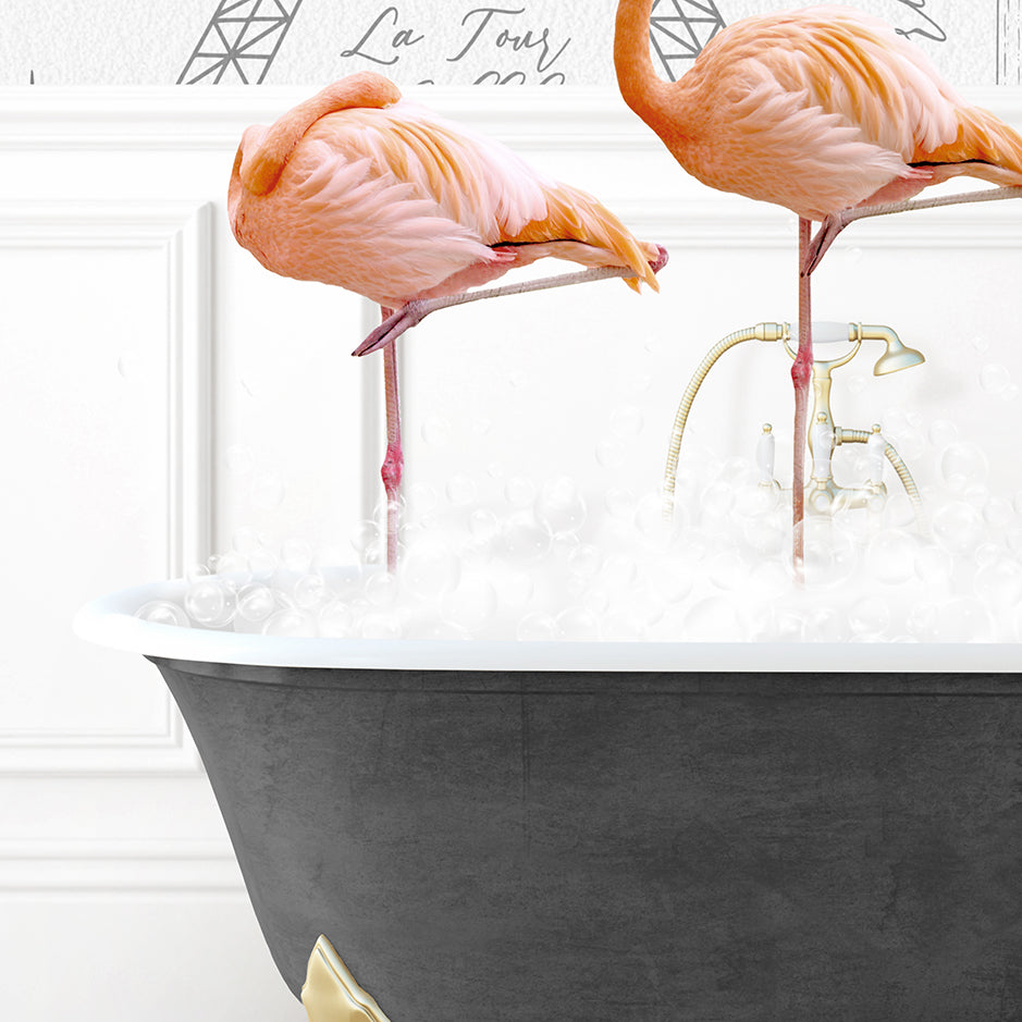 two pink flamingos standing in a bath tub