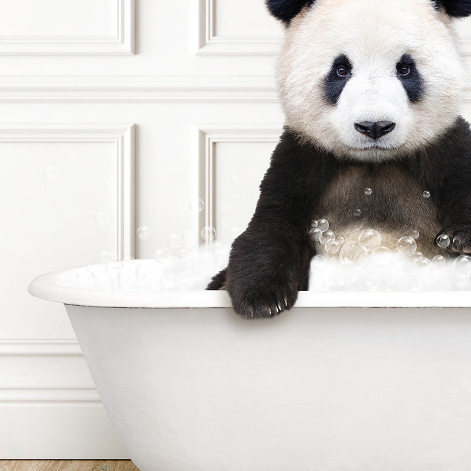 a panda bear is sitting in a bathtub