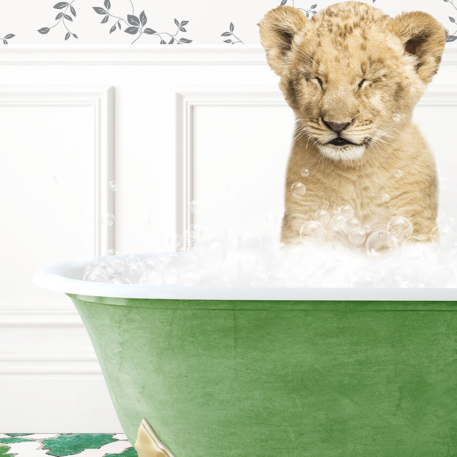 a lion cub sitting in a bathtub full of bubbles