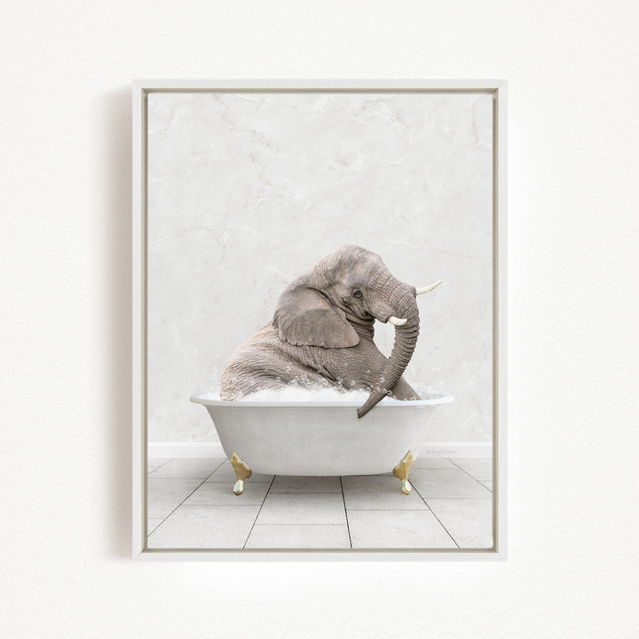 A gray elephant sitting in a white bathtub, with its trunk raised and appearing to be enjoying the bath.
