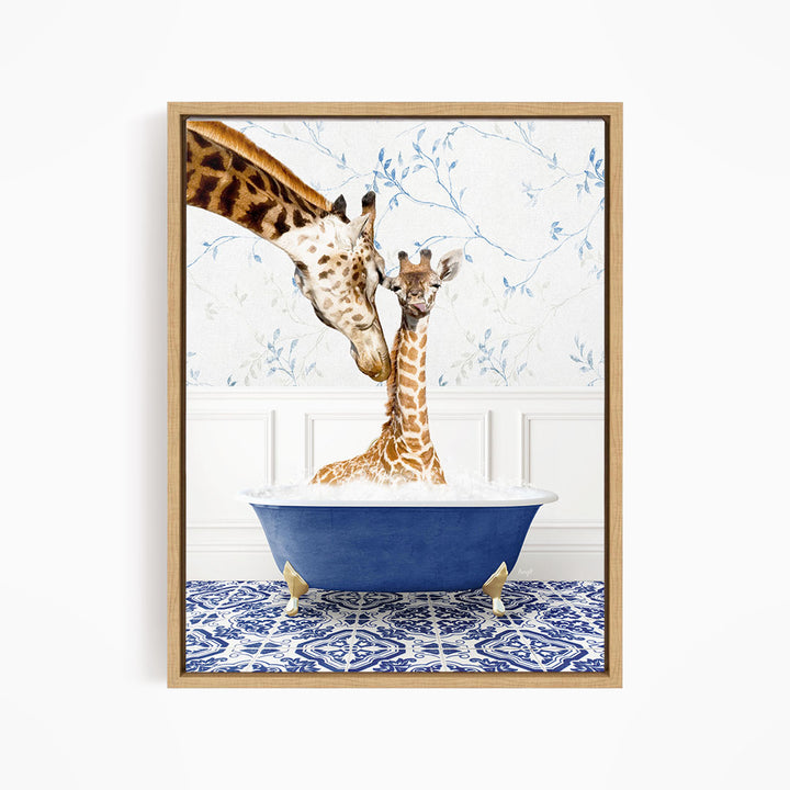 A mother giraffe and her baby giraffe are sitting together in a blue bathtub, with the mother gently nuzzling her baby.