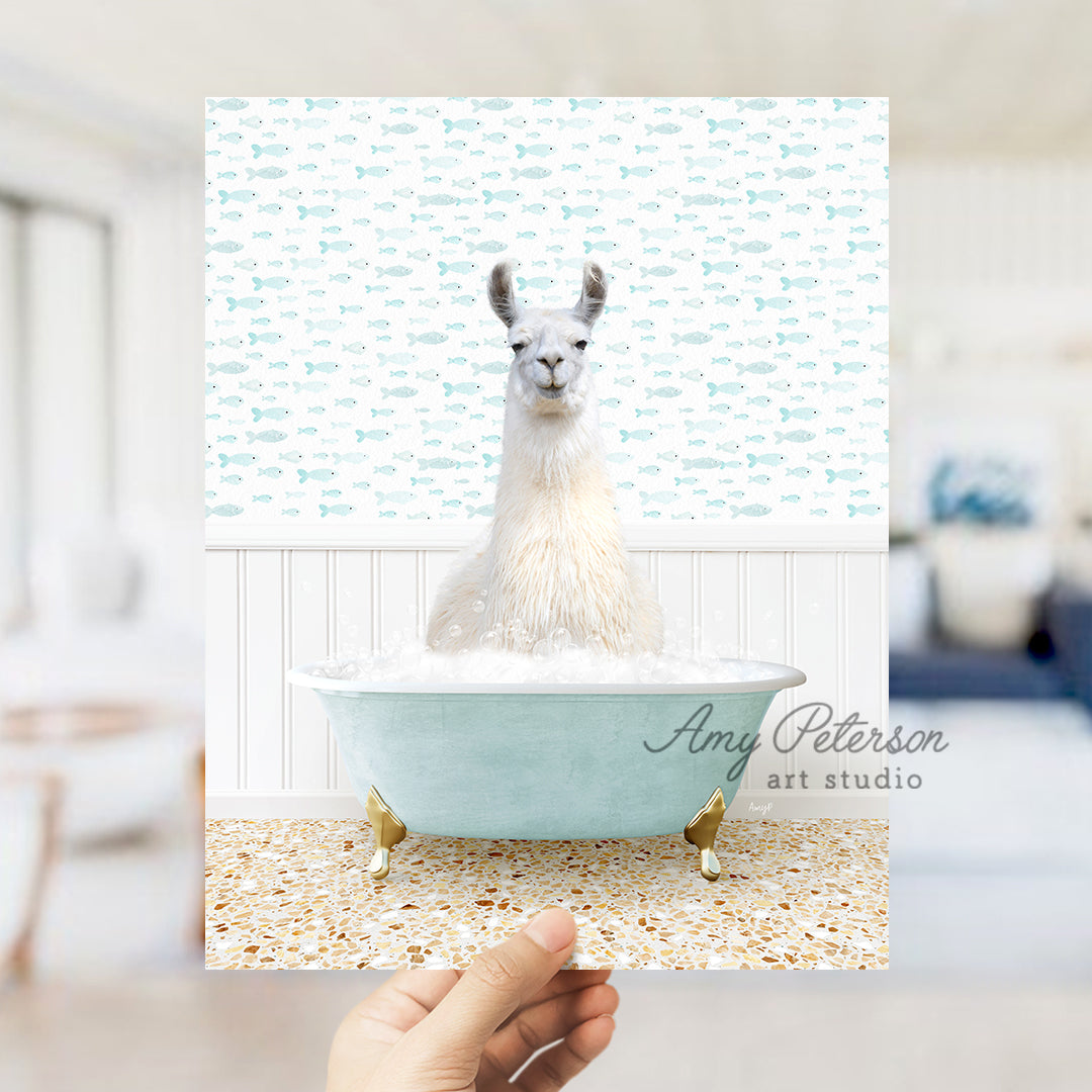 a llama in a bathtub with a hand holding up a card