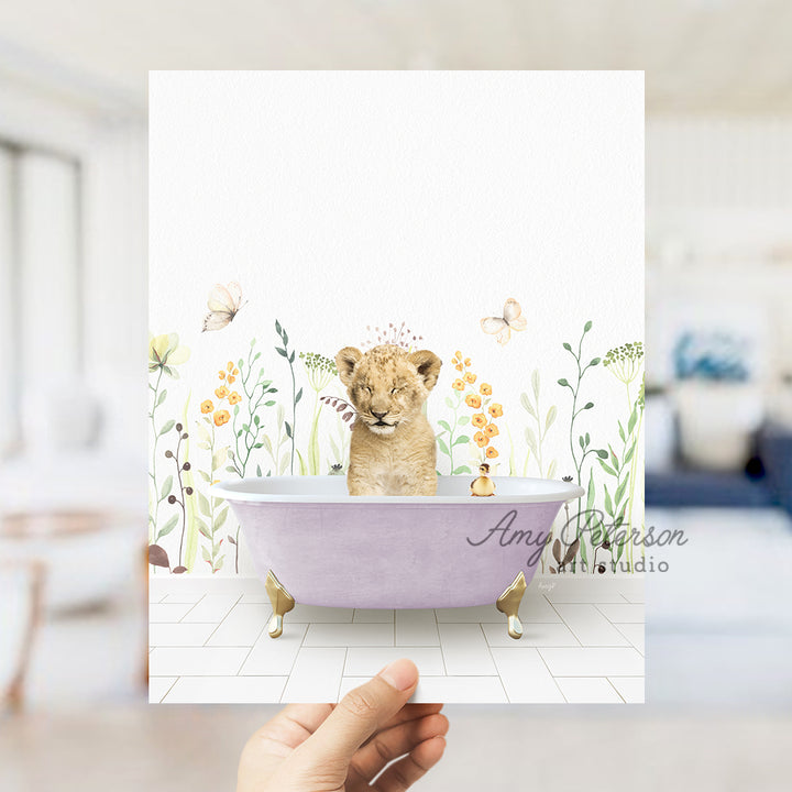 a hand holding up a card with a picture of a lion in a bathtub