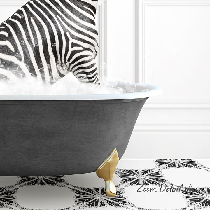 A zebra standing in a bathtub filled with bubbles, with a gold bathtub leg visible.