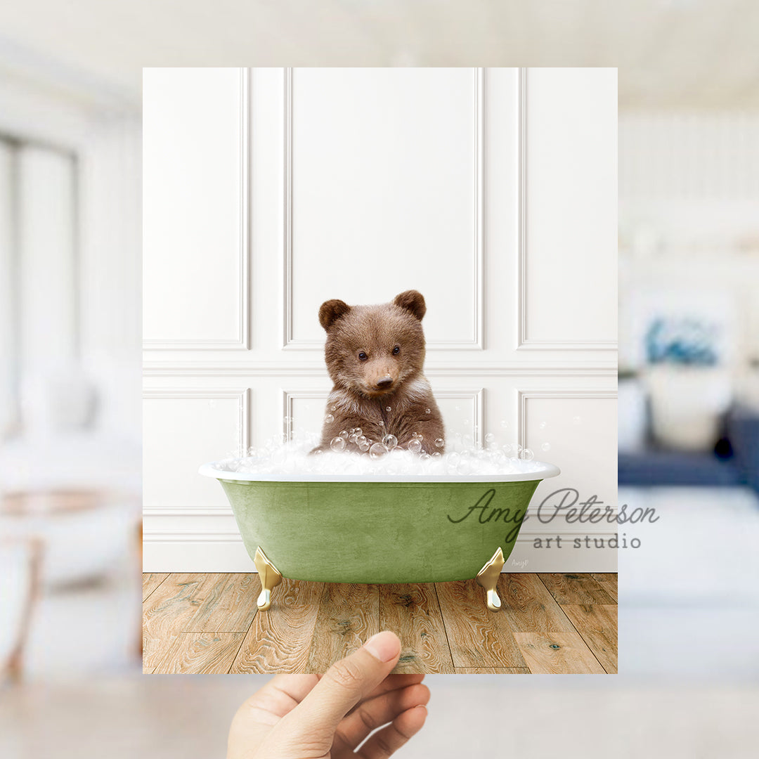 a small teddy bear sitting in a bath tub