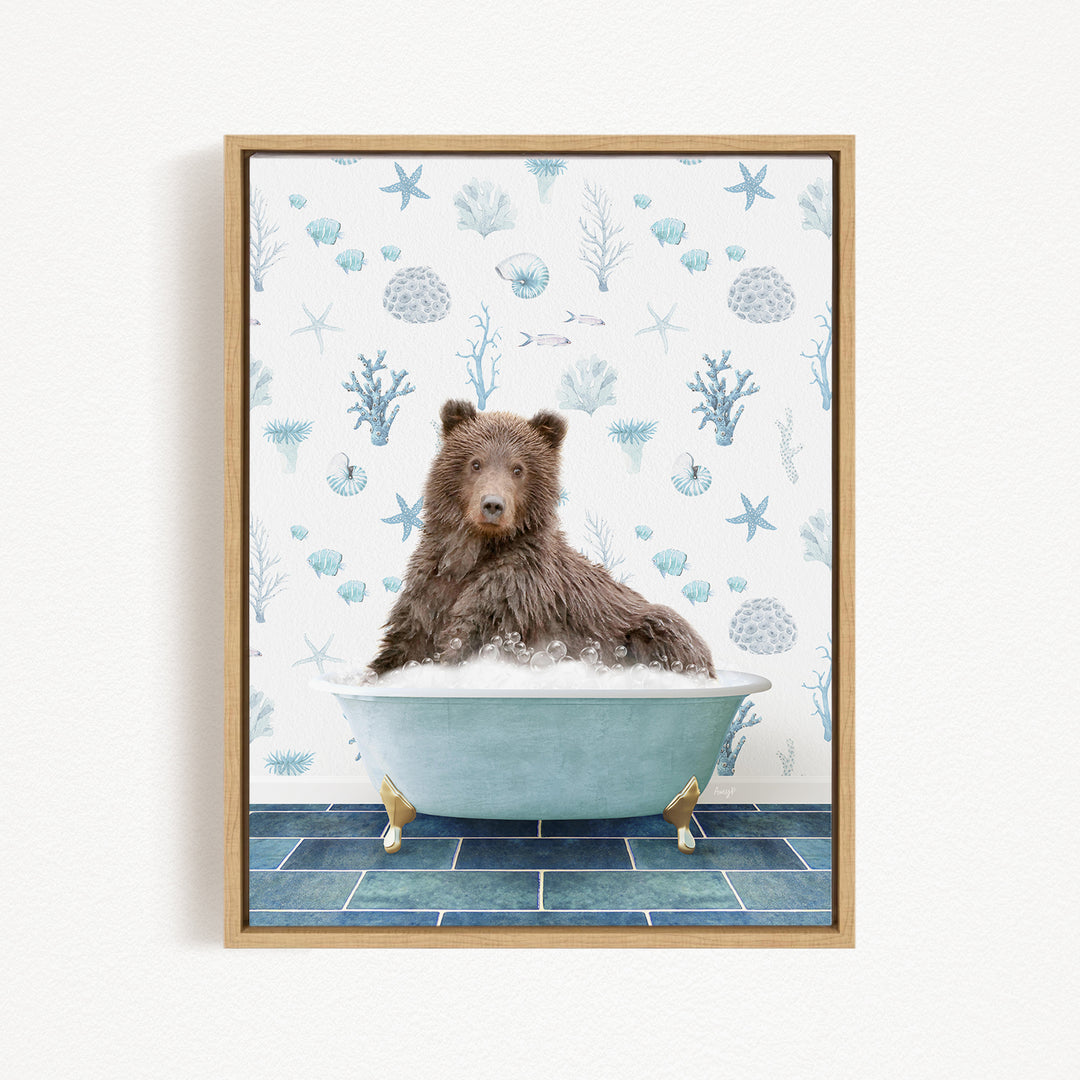 A brown bear sitting in a blue bathtub filled with bubbles, surrounded by a pattern of seashells, starfish, and other marine life.