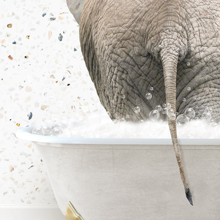 an elephant is taking a bath in a bathtub