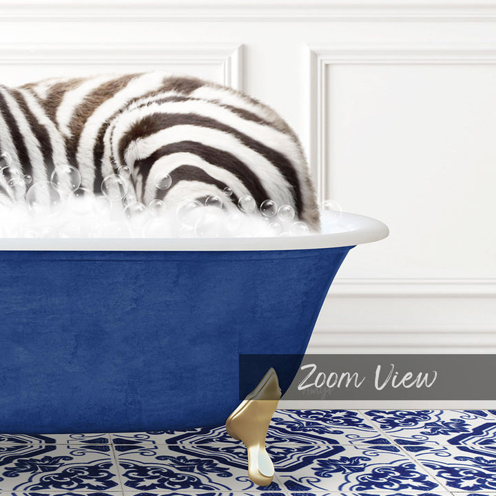 A zebra lying in a blue bathtub filled with bubbles, with a white wall and a patterned tile floor in the background.