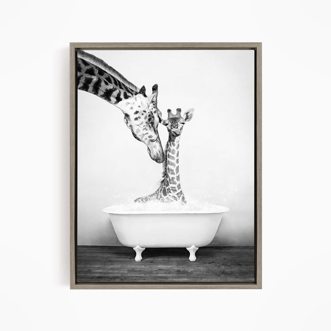 A mother giraffe and her baby giraffe enjoying a bath together in a white bathtub.