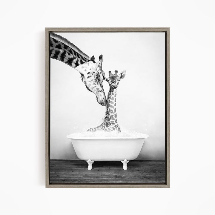 A mother giraffe and her baby giraffe enjoying a bath together in a white bathtub.