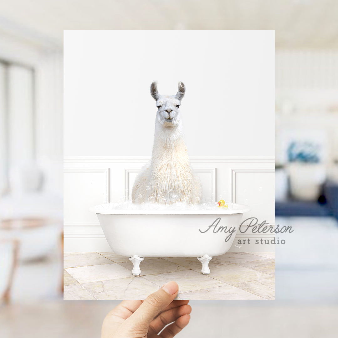 a person holding up a card with a llama in a bathtub