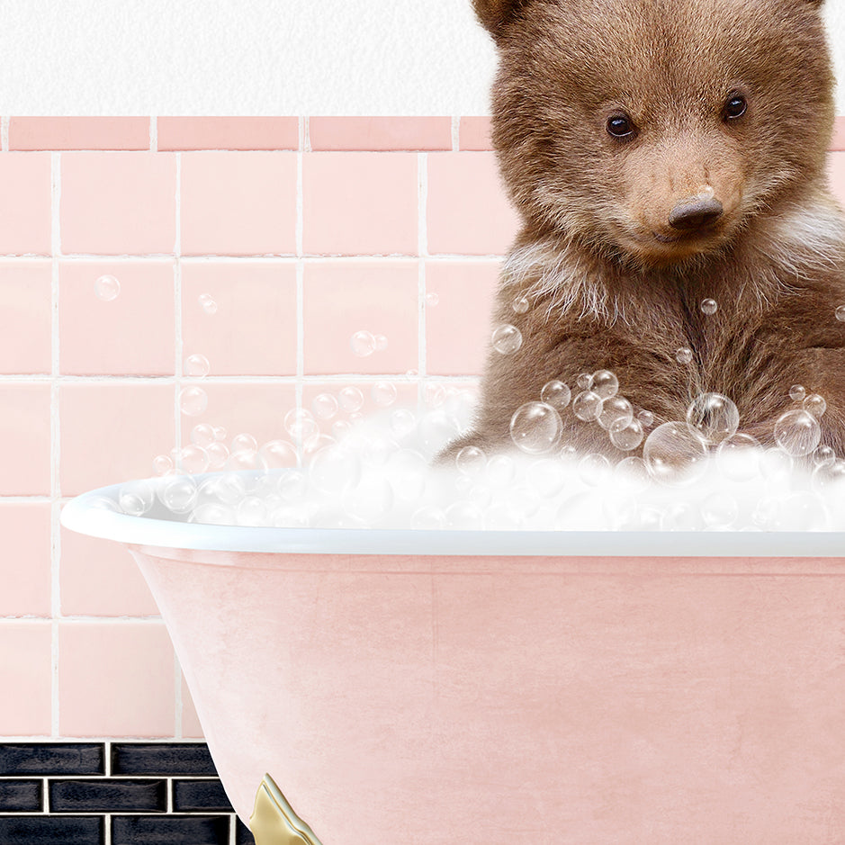 a brown bear sitting in a bath tub filled with bubbles