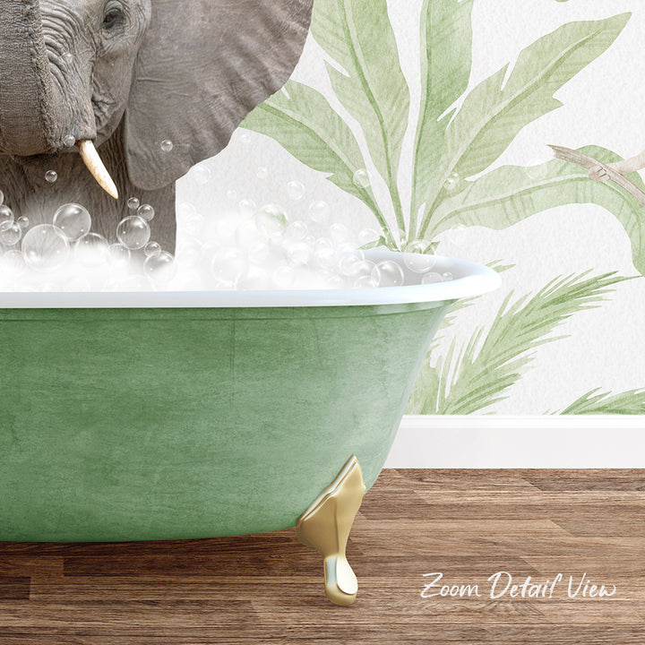 A green clawfoot bathtub filled with bubbles, with an elephant standing inside it.