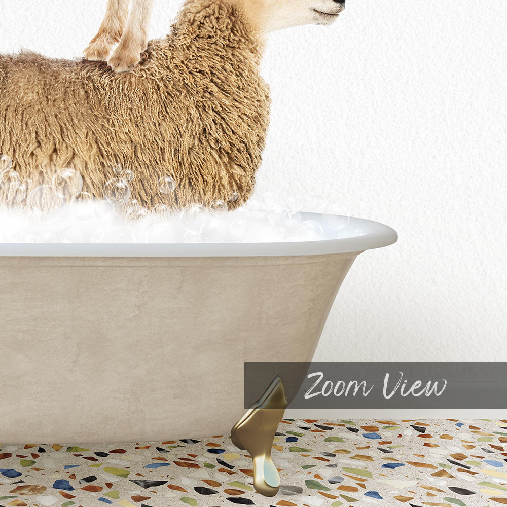 A fluffy brown sheep is sitting in a bathtub filled with water, with bubbles around it.