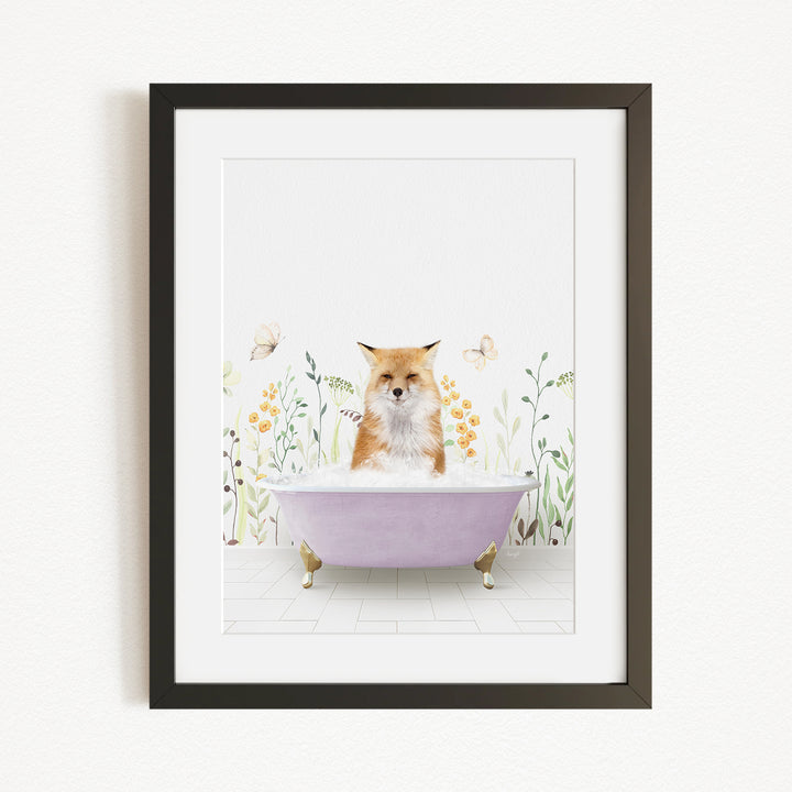 A framed print depicting a fox sitting in a bathtub filled with bubbles, surrounded by flowers and butterflies.