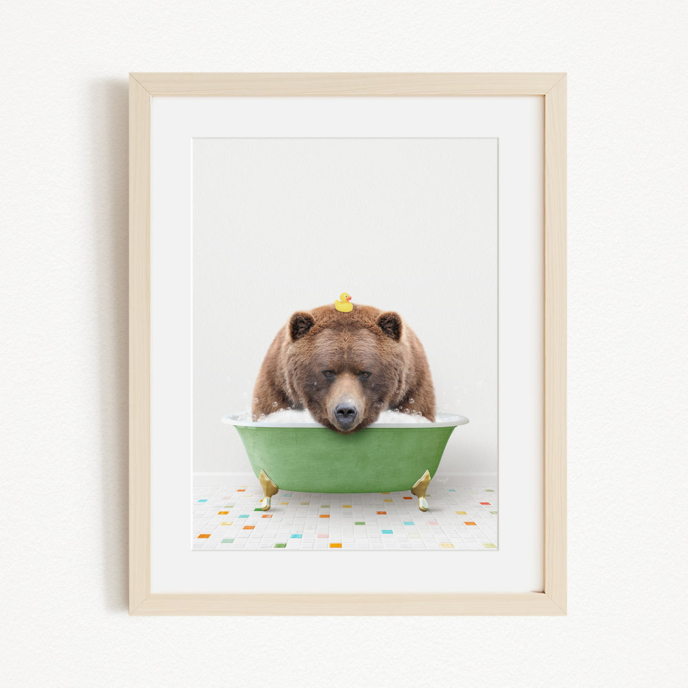 A brown bear is sitting in a green bathtub, surrounded by rubber ducks.
