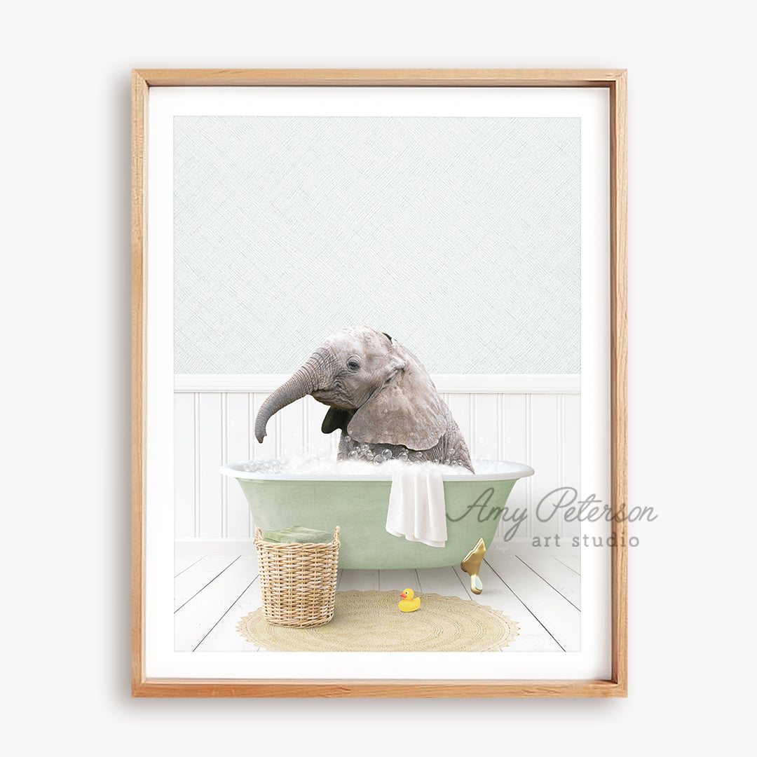 a picture of an elephant taking a bath