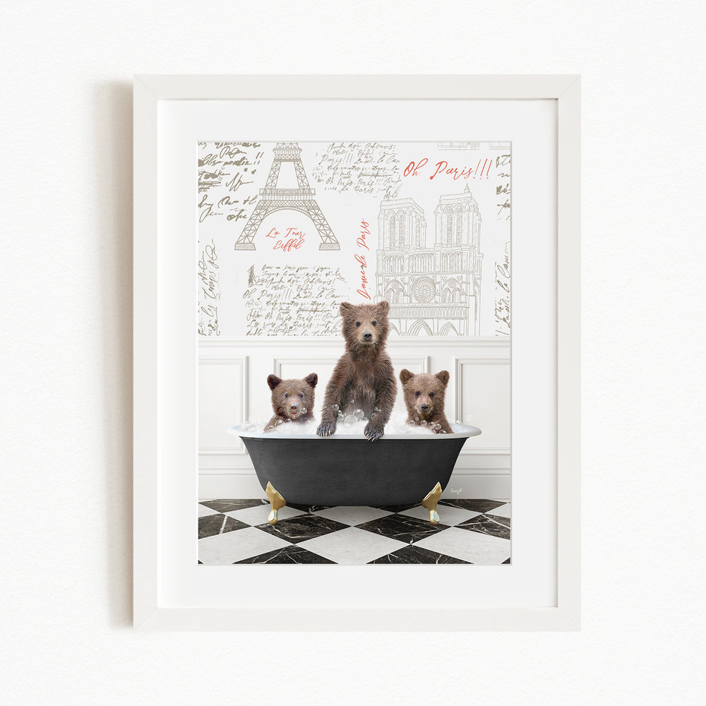 A framed image depicting three bears sitting in a bathtub, with a Paris-themed background featuring the Eiffel Tower and other Parisian landmarks.