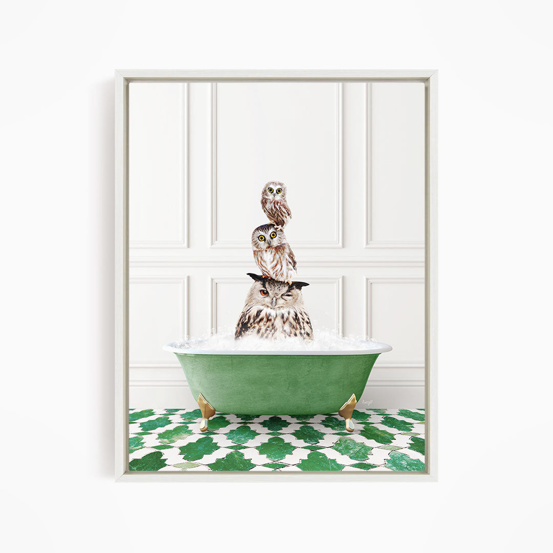 A framed image depicting a group of owls sitting in a green bathtub filled with water, creating a whimsical and playful scene.