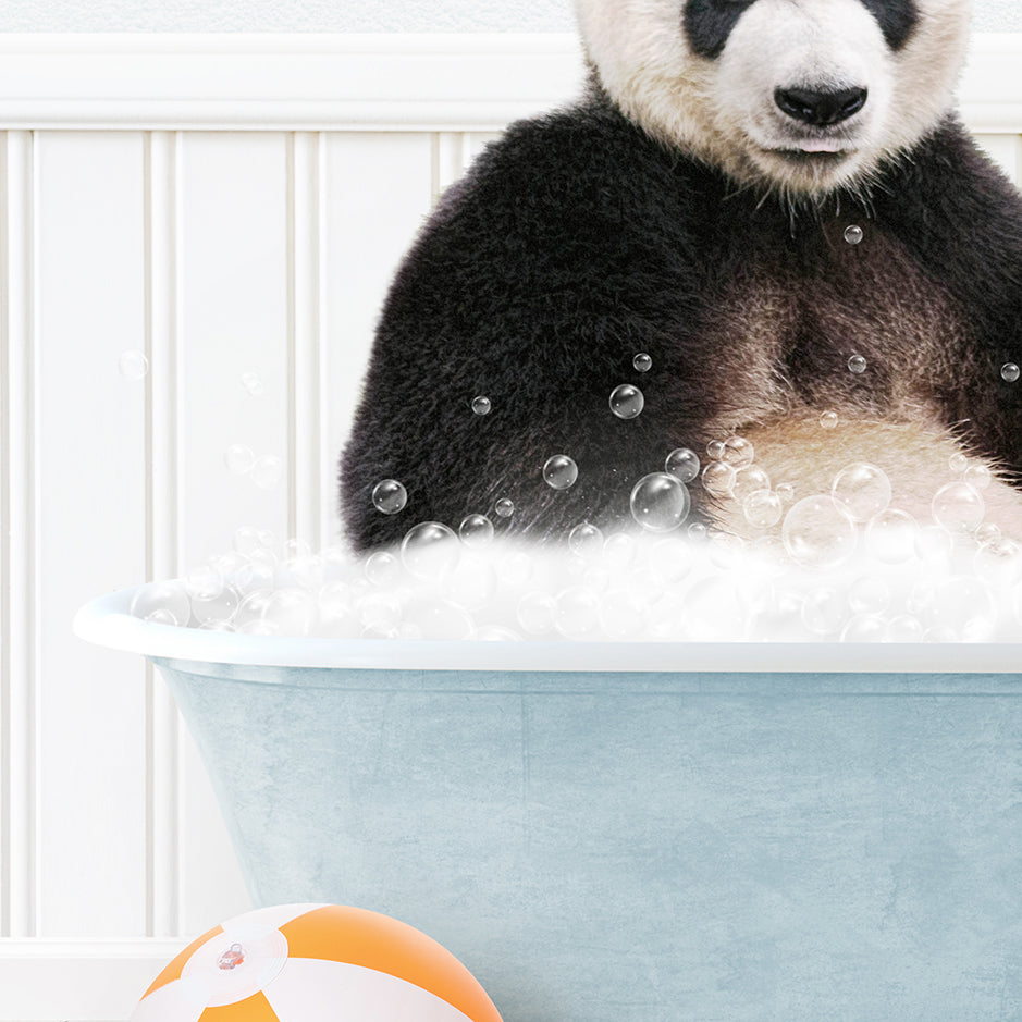 a panda bear sitting in a bathtub with bubbles