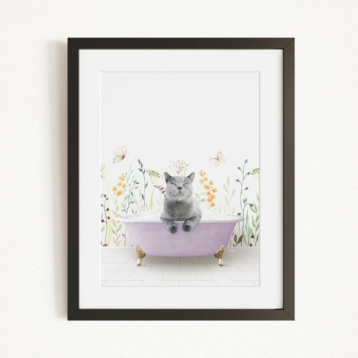 A gray cat sitting in a pink bathtub, surrounded by flowers and butterflies, creating a whimsical and serene scene.