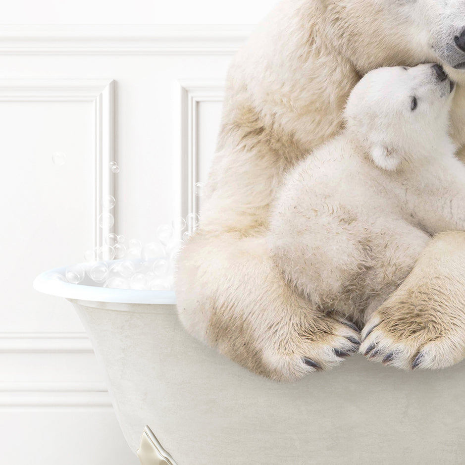 a mother polar bear cuddles her cub in a bathtub