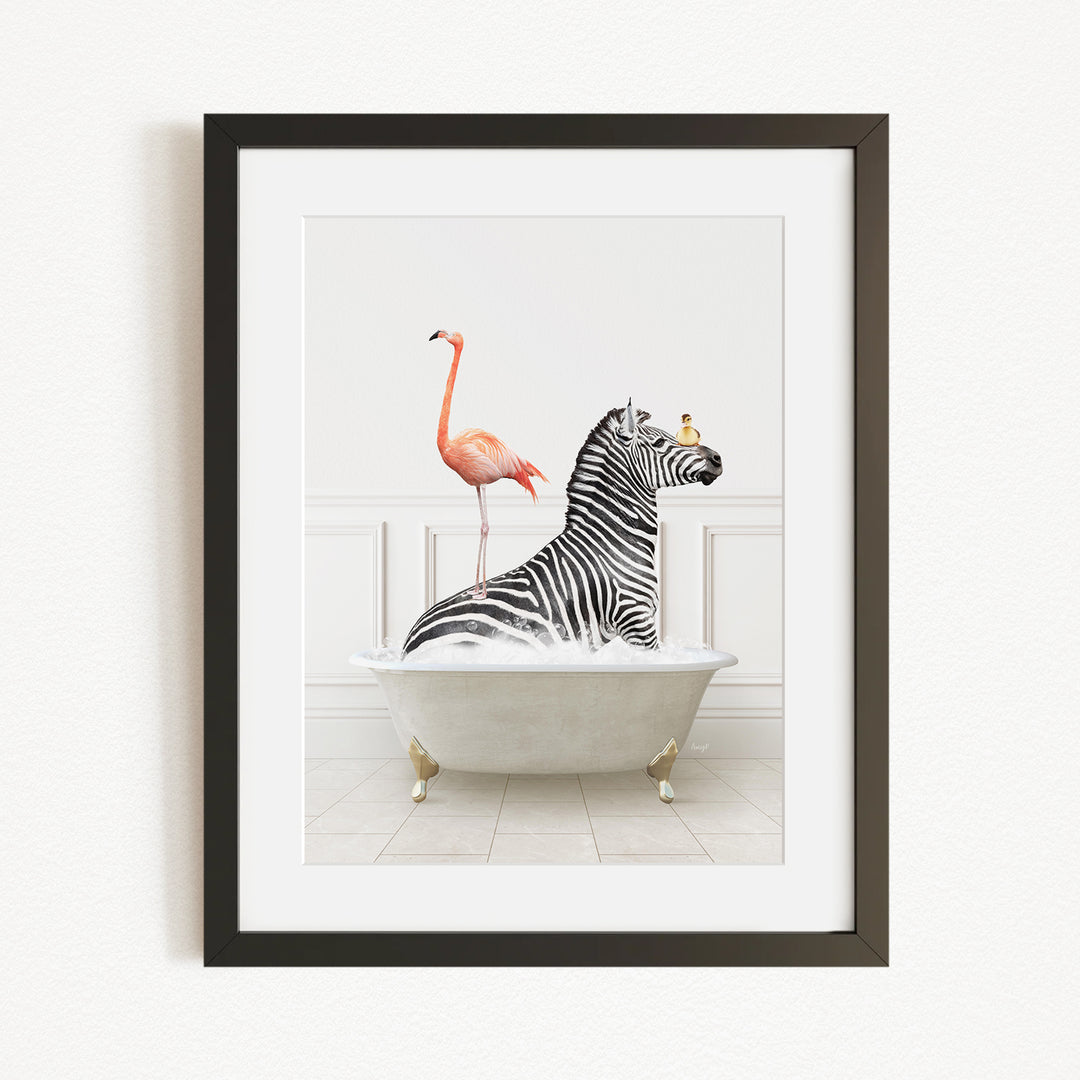 A framed image depicting a zebra sitting in a bathtub, with a flamingo standing on its back and a bird perched on its head.