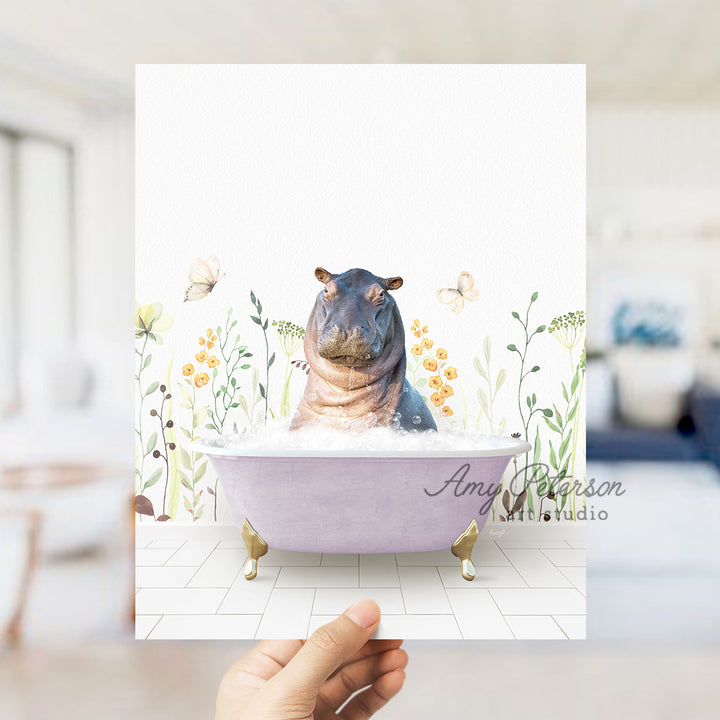 a hippo sitting in a bathtub with flowers around it