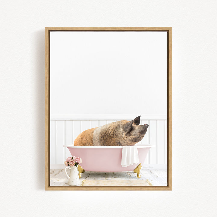 A pig sitting in a pink bathtub, surrounded by flowers and a white vase.