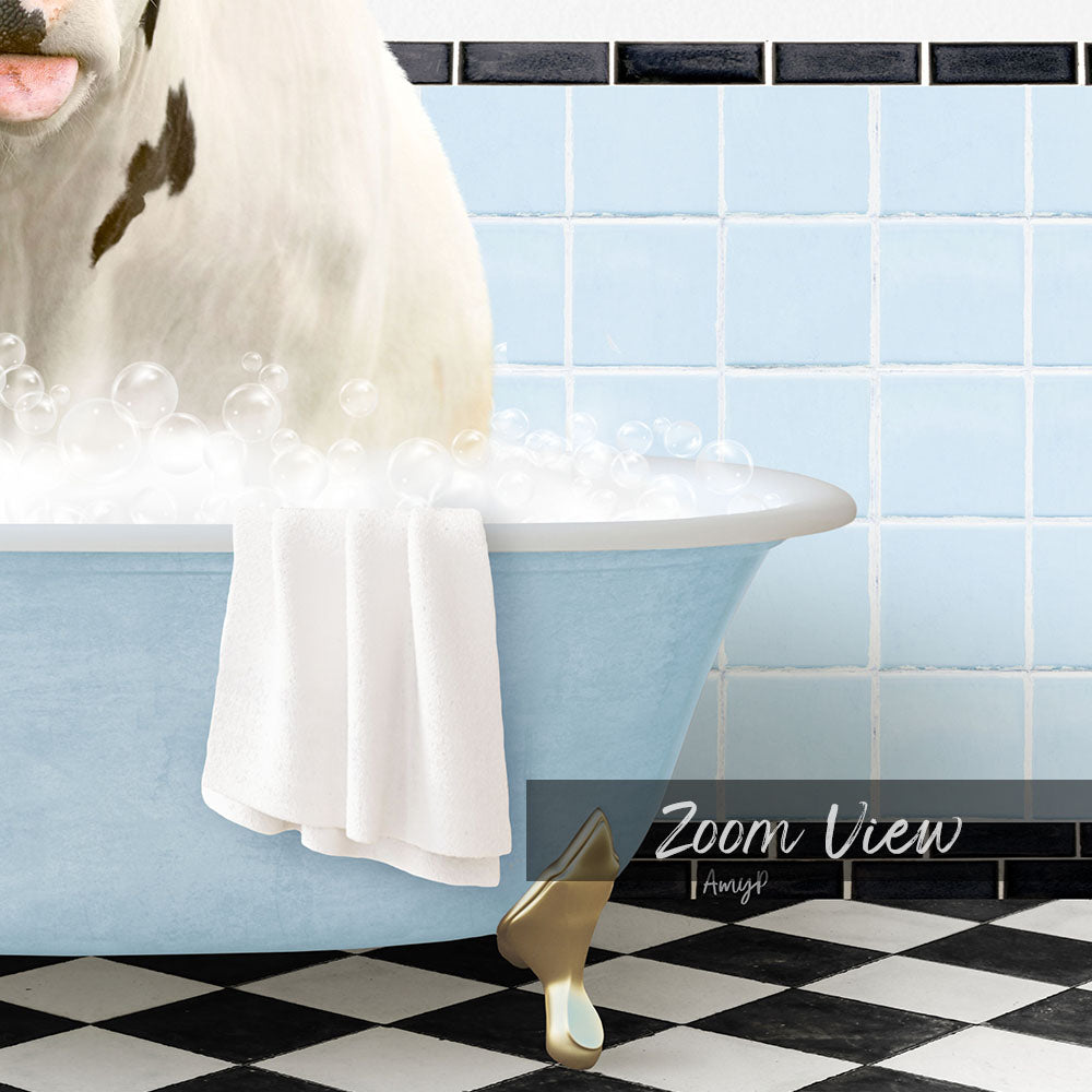 A white cow is sitting in a blue bathtub filled with bubbles, with a towel draped over the side and a gold shoe placed on the floor.